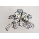 A marcasite and green rhinestone floral spray broo