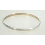 A sterling silver bangle bracelet of circular form
