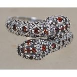 A  silver  red stone and marcasite set dress ring