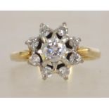 An 18ct gold and diamond ring having starburst mou