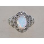 An Art Deco style ring set with a central opal and