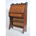 A 19th century Arts & Crafts oak students bureau.