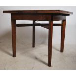 A 1940's golden oak square draw leaf dining table