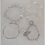 A collection of 4 silver bracelets to include doub