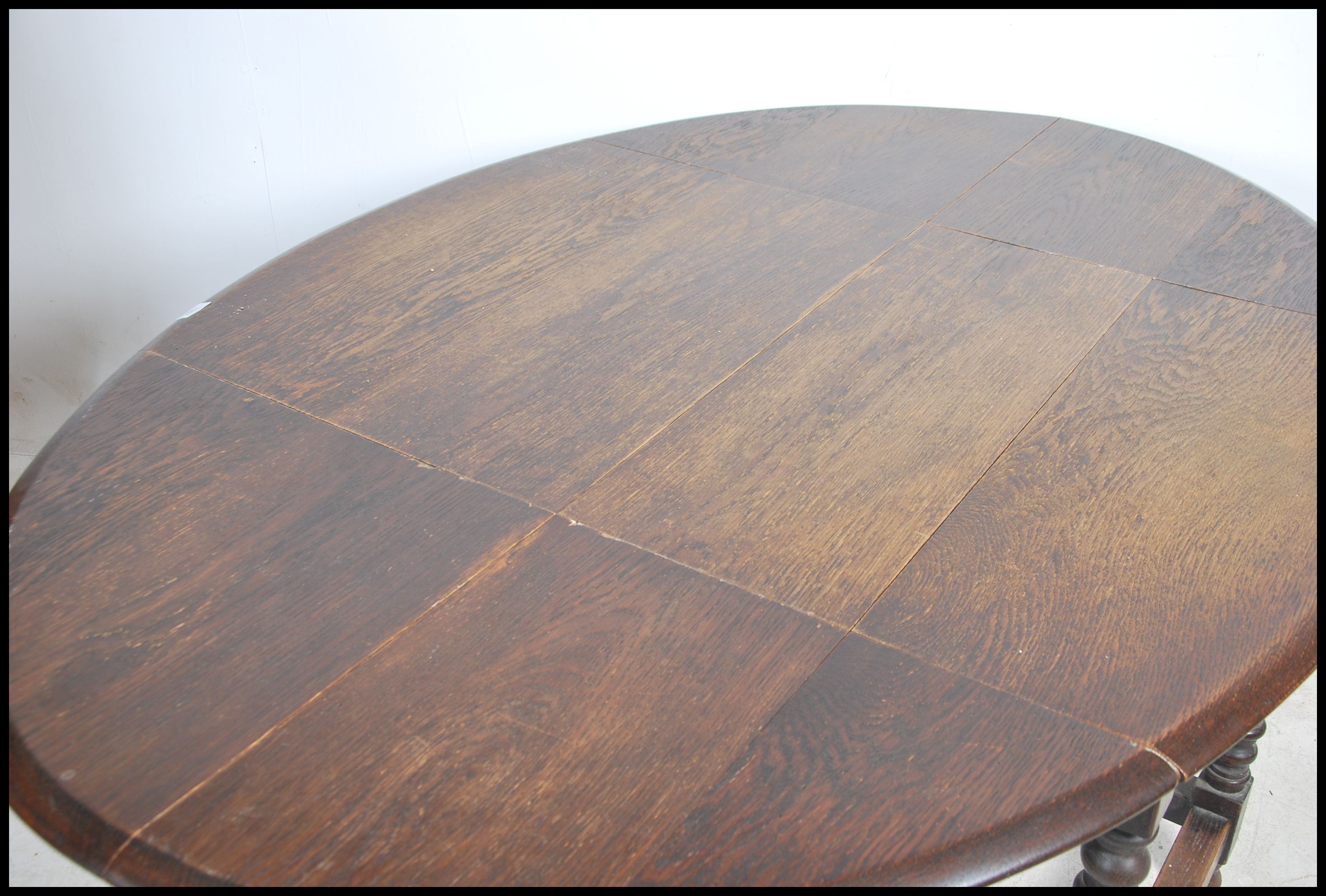 A 1930's large solid oak gateleg dining table. The - Image 4 of 4