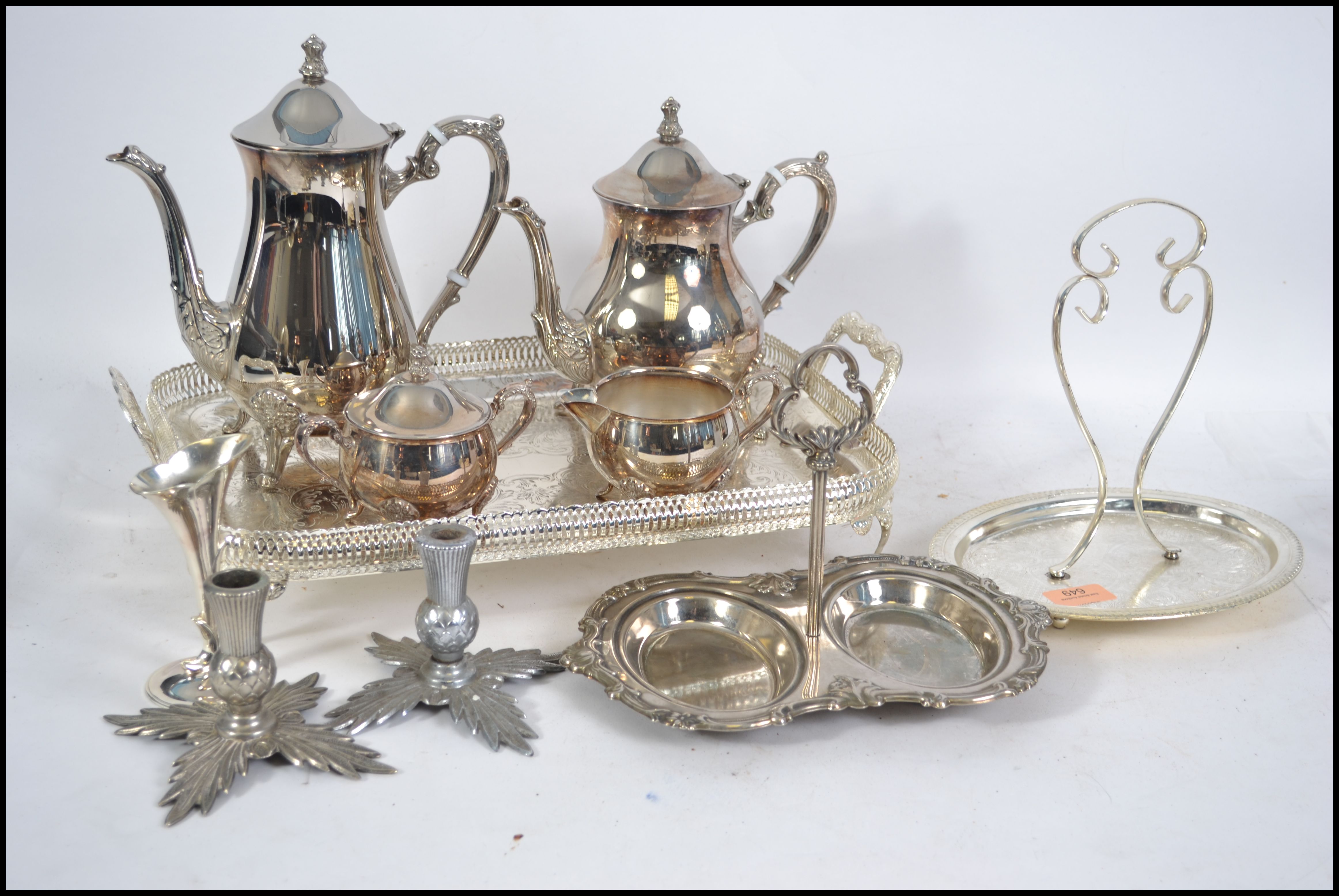 A silver plate tea and coffee service having a gal