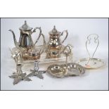 A silver plate tea and coffee service having a gal