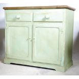 An early 20th century pine scrubbed top cupboard.