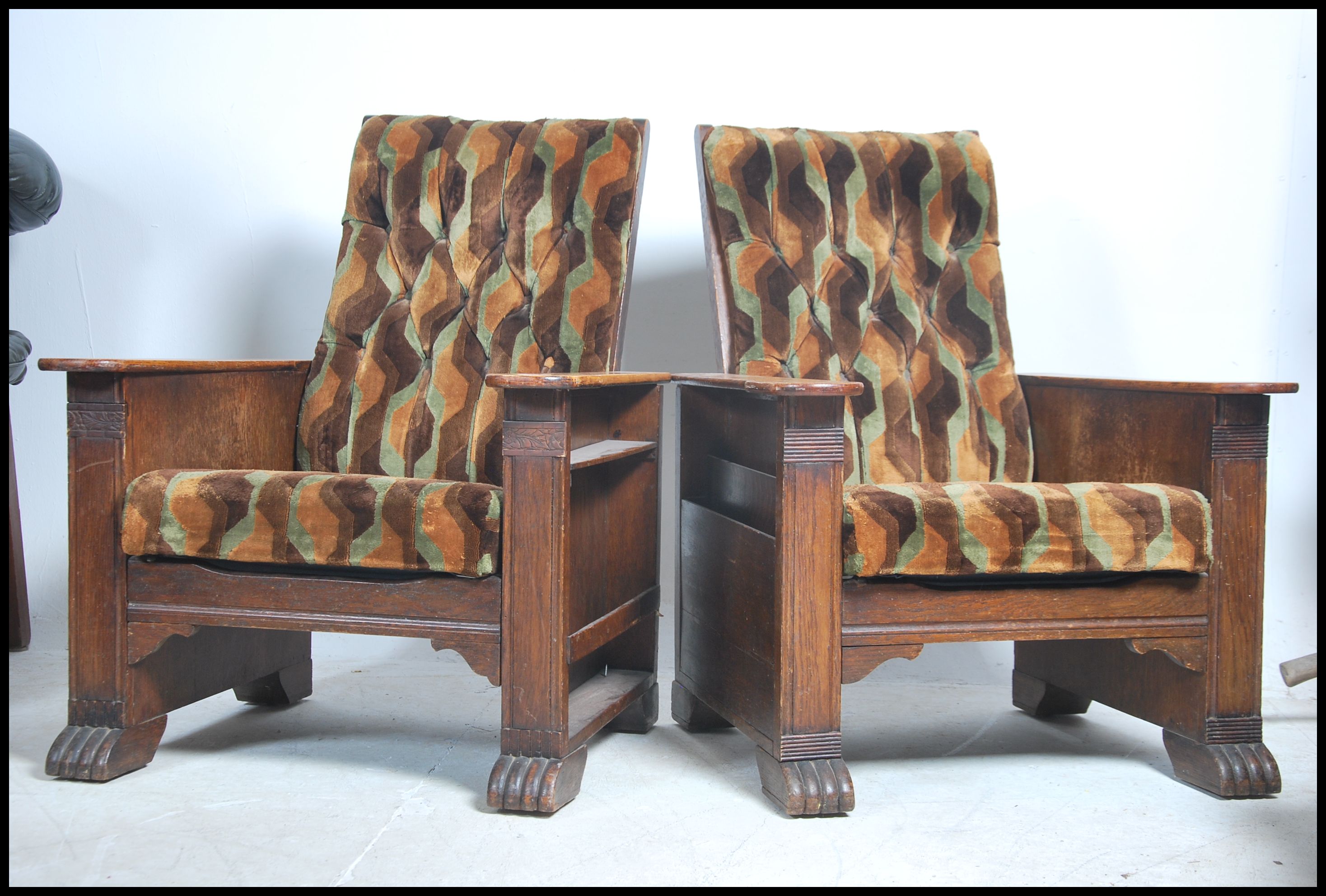 A pair of 1930's Art Deco oak reclining armchairs.