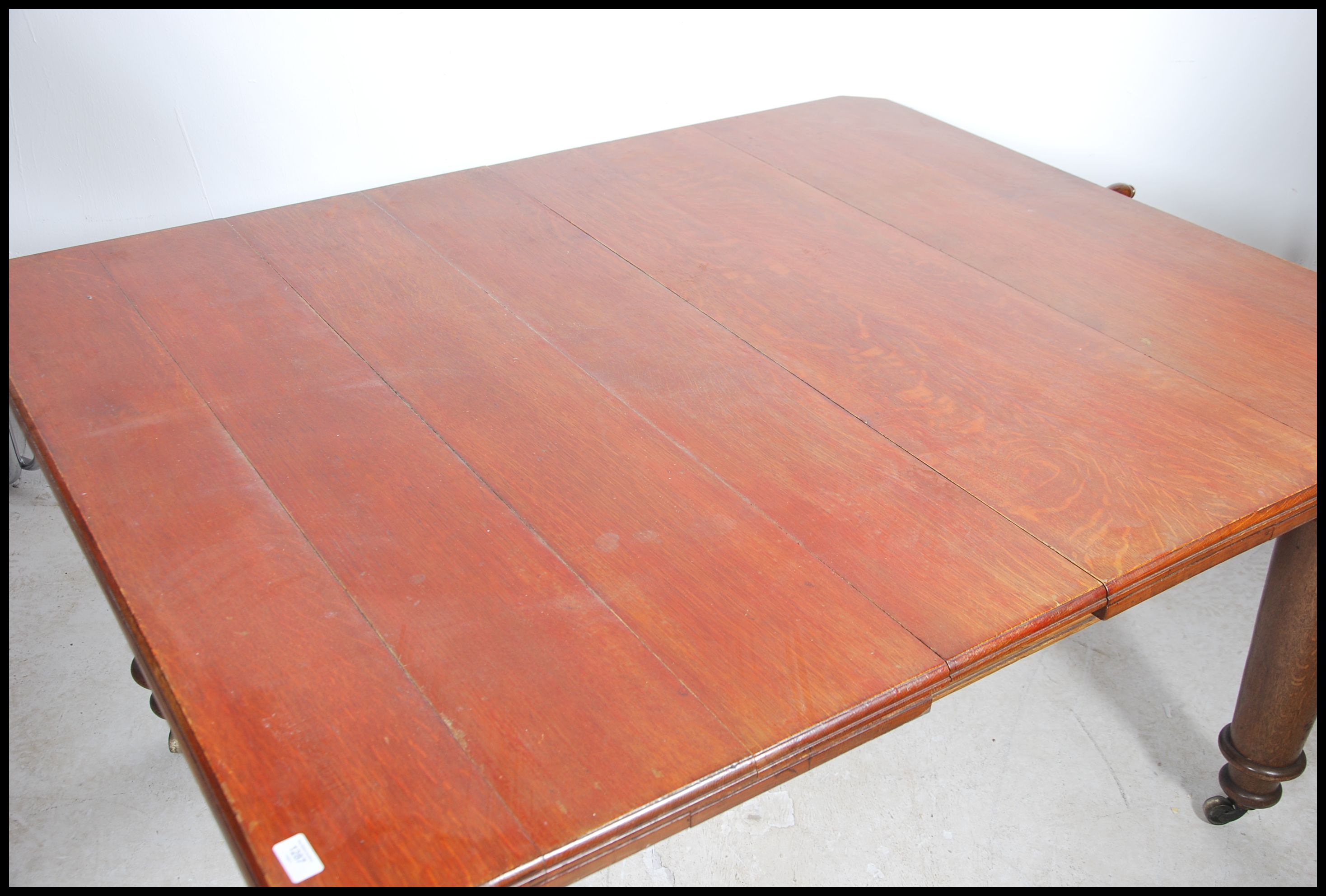 A large Victorian twin leaf wind out dining table - Image 2 of 5