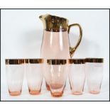 A vintage mid 20th century rose glass lemonade set