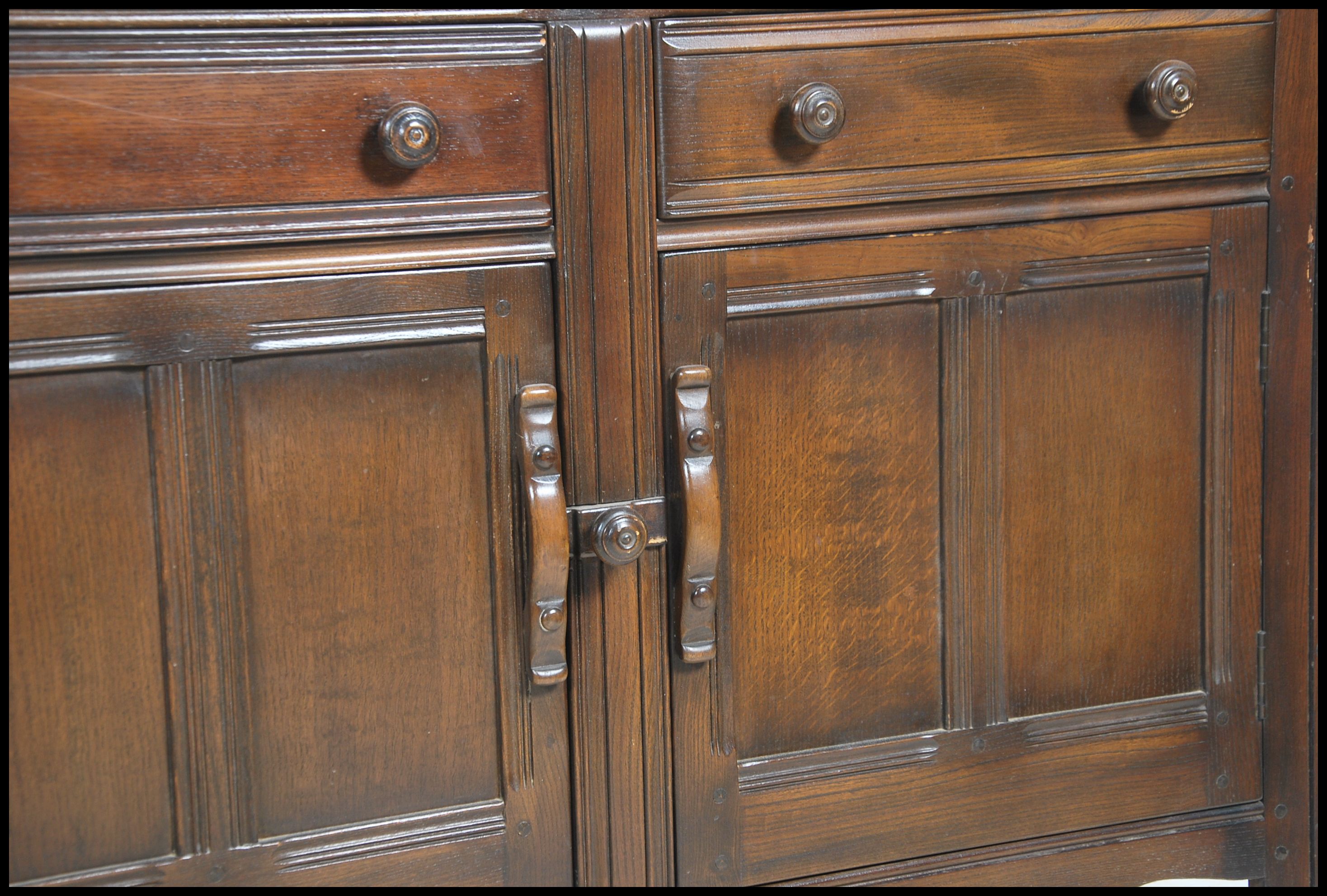 A 20th century Ercol court cupboard in beech and e - Image 2 of 5