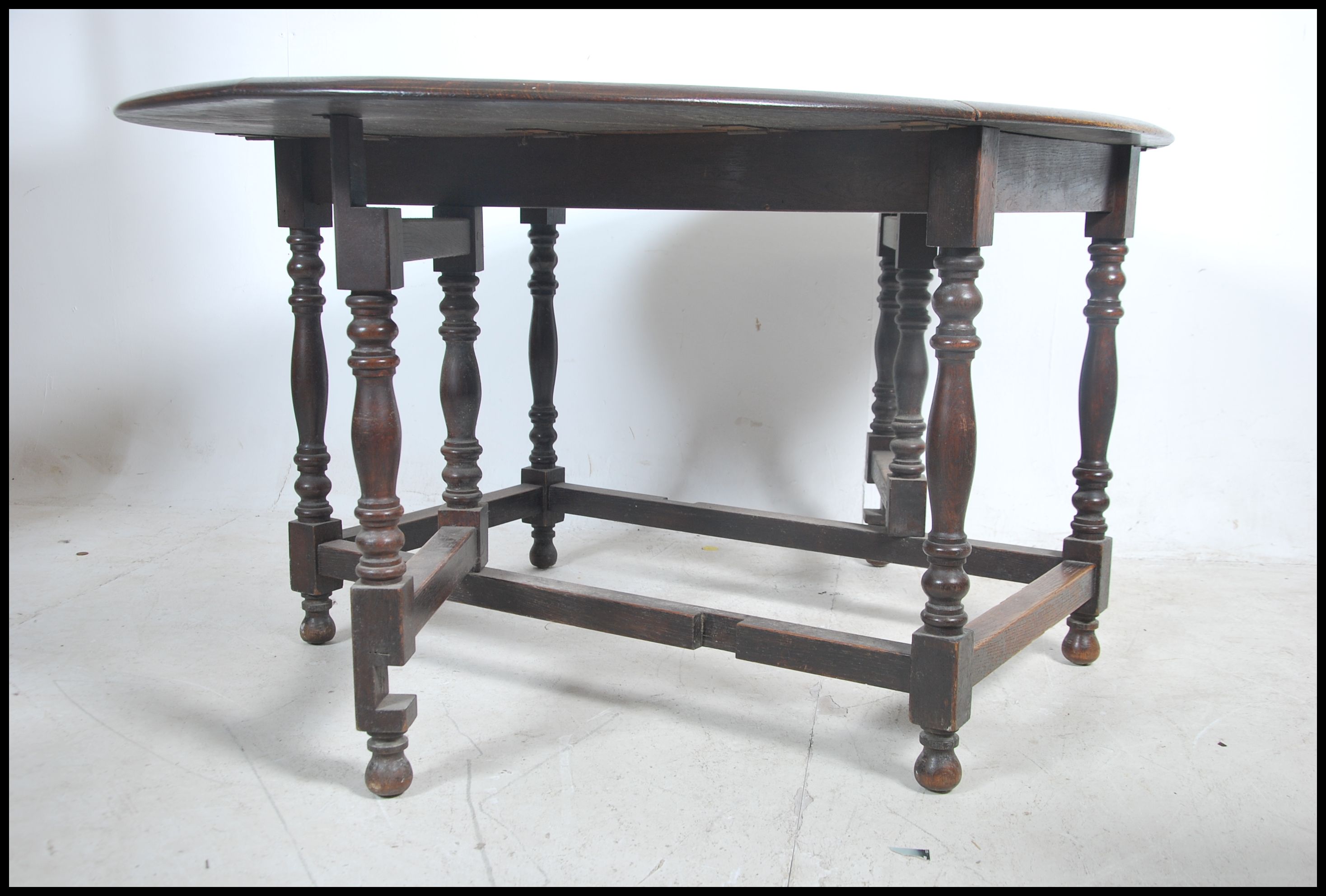 A 1930's large solid oak gateleg dining table. The - Image 3 of 4