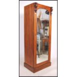 A Victorian mahogany sentry box wardrobe having pl