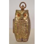 An unusual  brass cased owl shaped sovereign case