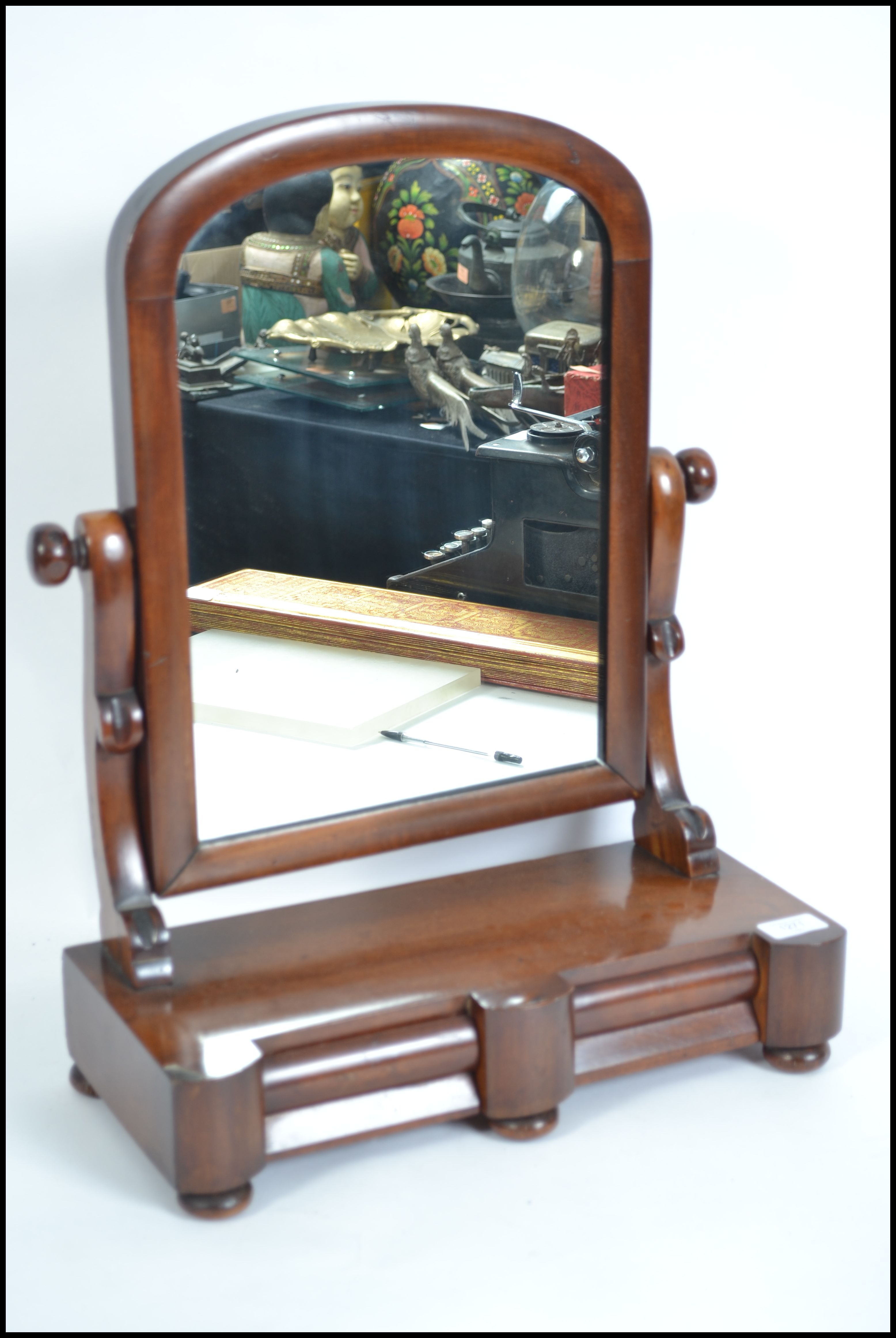 A Victorian mahogany toilet swing mirror having tw