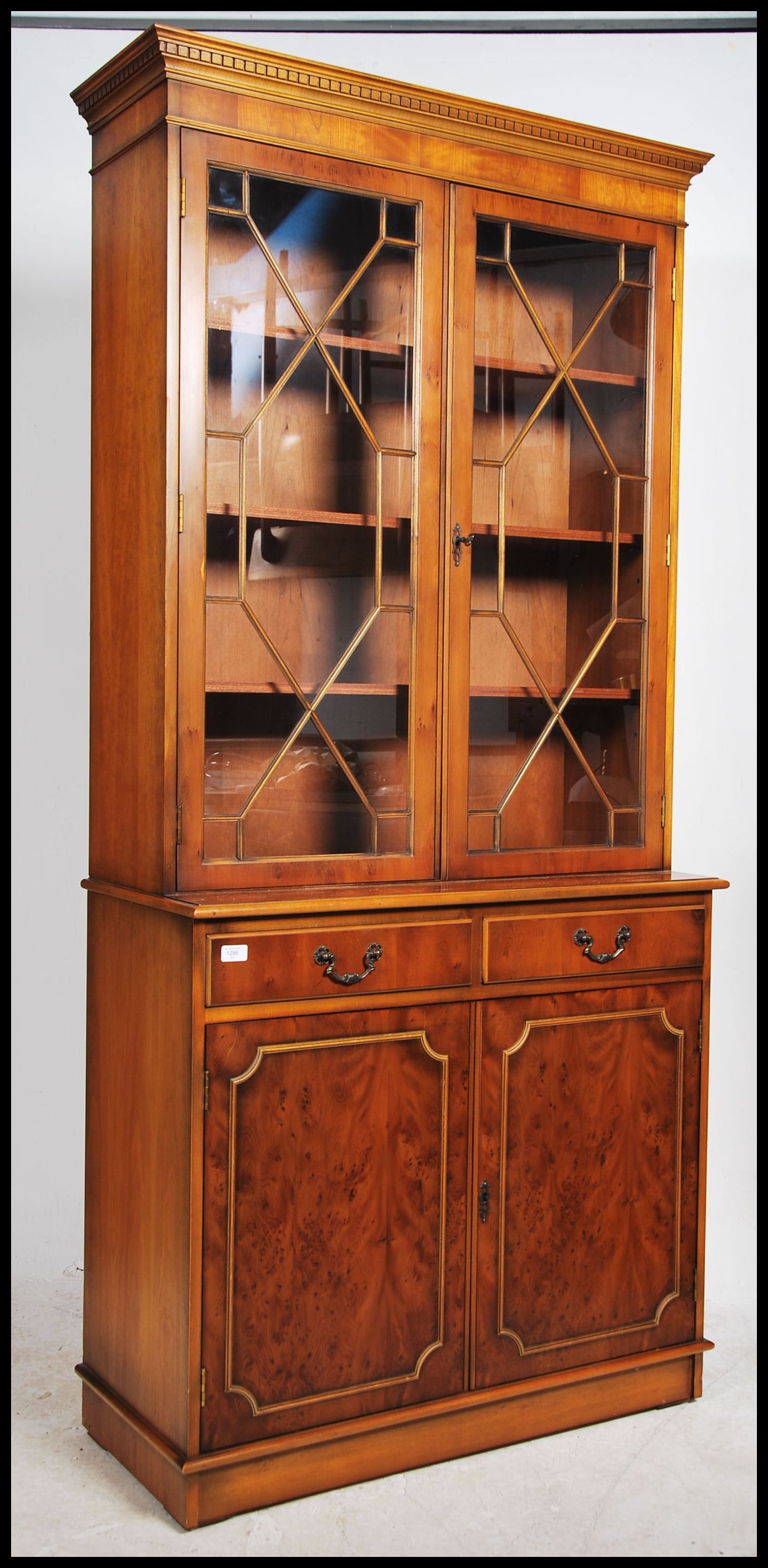 A Regency style yew wood veneer library bookcase c