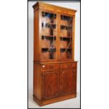 A Regency style yew wood veneer library bookcase c