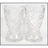 A pair of large crystal cut glass cases with unusual star design. Thes vases of bulbous form with