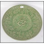 A large Chinese Celadon porcelain, of saucer shape
