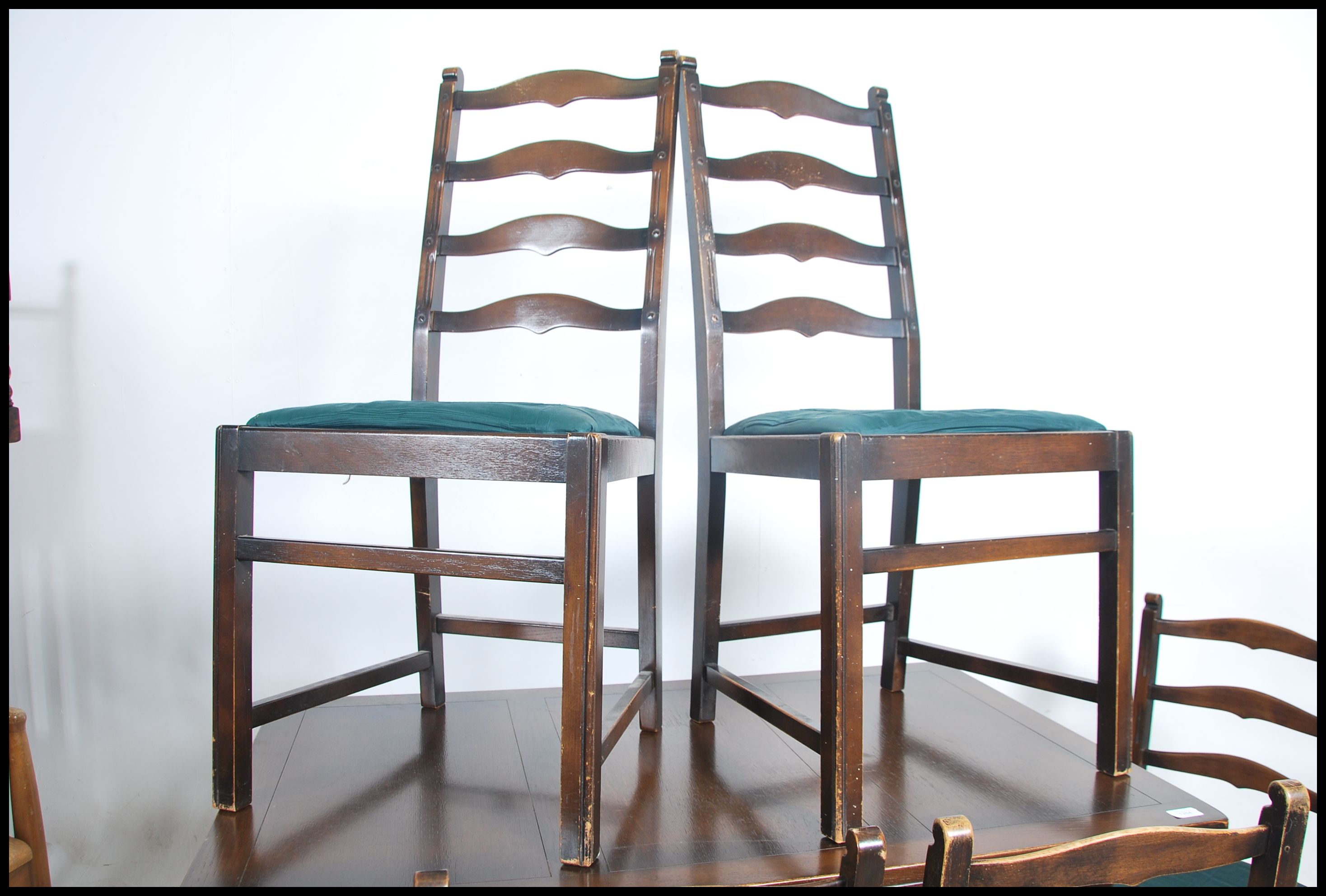 A mid 20th century beech and elm dining suite by E - Image 3 of 6