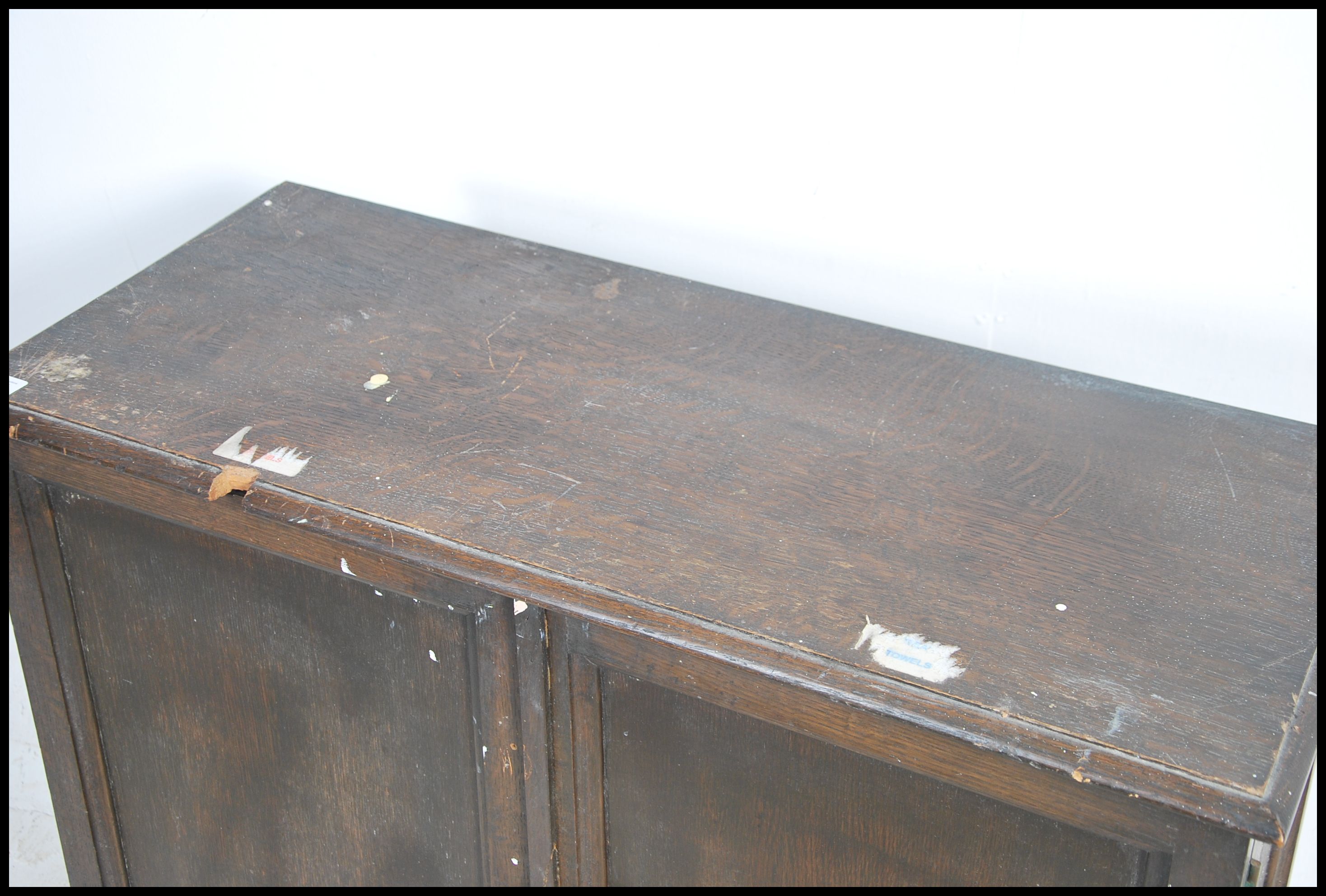 An Edwardian country oak estate cupboard being rai - Image 2 of 4