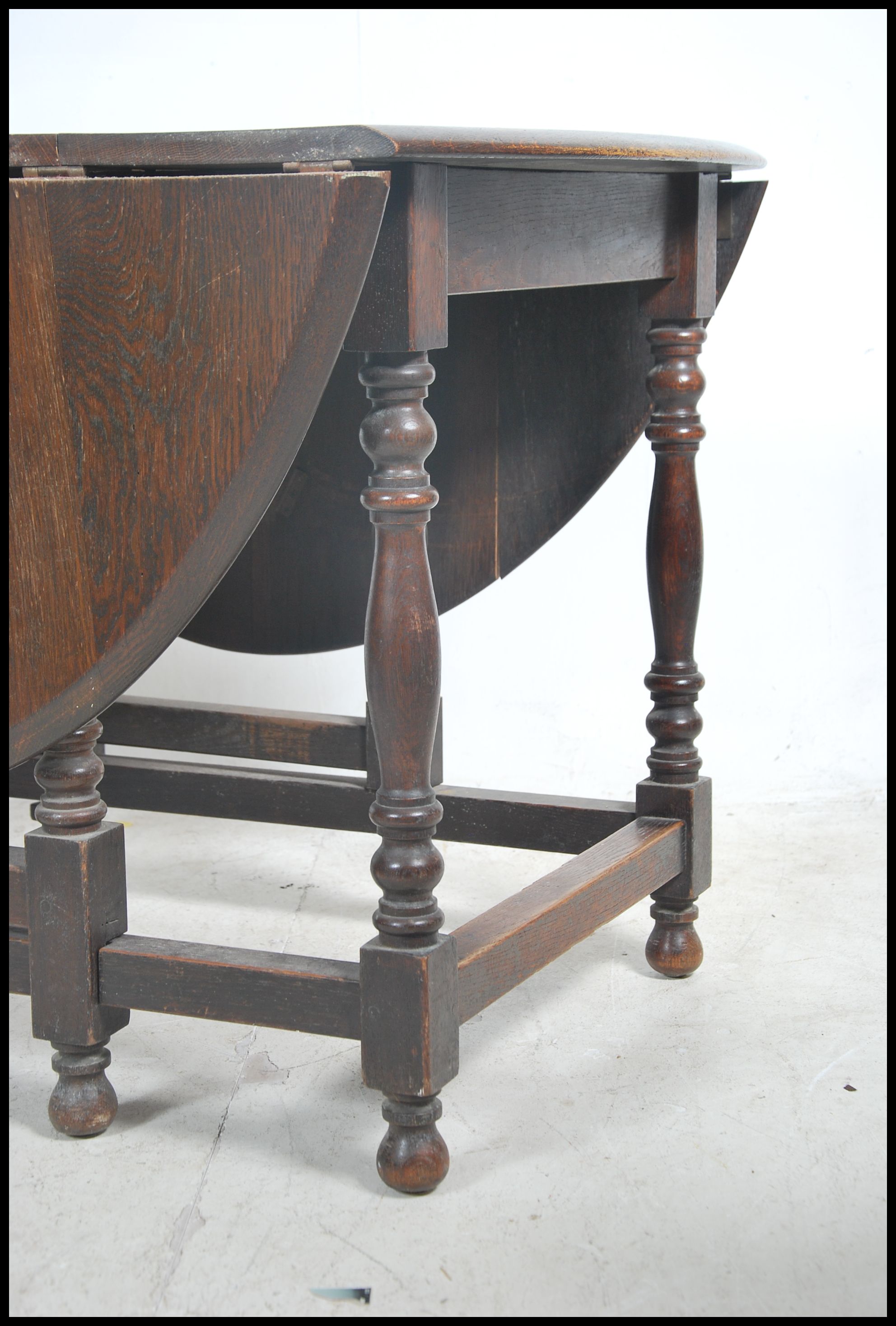 A 1930's large solid oak gateleg dining table. The - Image 2 of 4