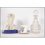 A group of 19th century ceramics to include a Staffordshire Poodle figure group, a Dresden tea caddy