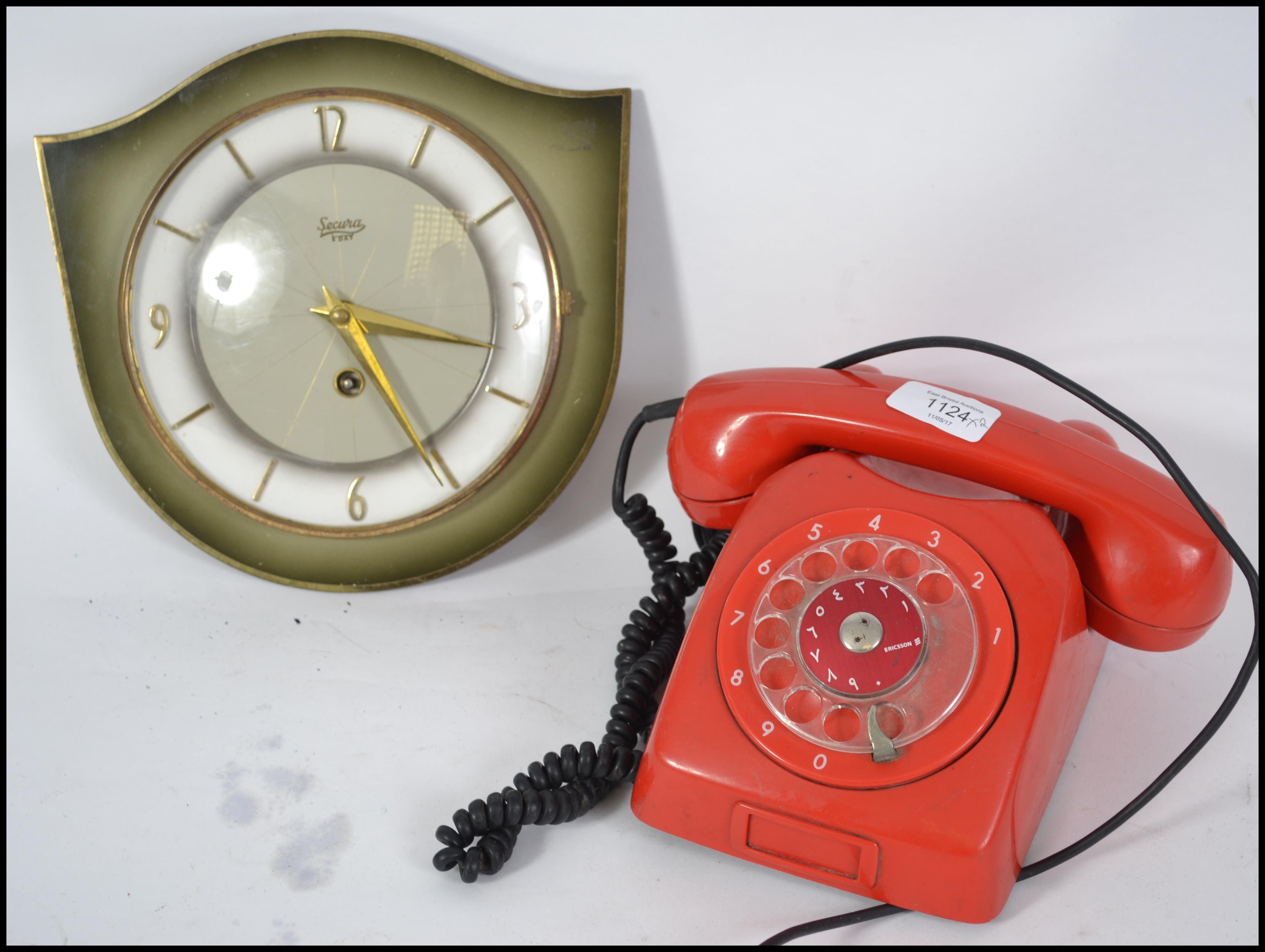 A retro 20th century red ring dial telephone toget