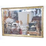 A 20th century vintage framed mirror decorated wit