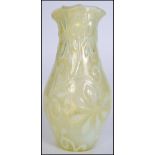 An early 20th century Uranium irridescent glass vase with fabulous floral design with handkerchief