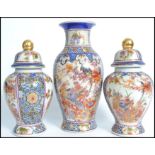 A collection of 3 Chinese vases each of different design and all being raised on socle plinth bases.