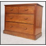 An early 20th century 1920's oak square fronted walnut cottage chest of two short over three long