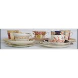 A collection of 5 19th century ceramic trio's to include a 19th century Crown Derby Imari pattern