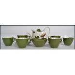 A retro 20th century Midwinter Style Craft 6 person tea service consisting of 6 cups and saucers,