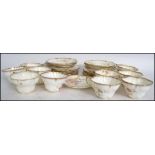 A late 19th / early 20th century bone China hand painted floral tea service consisting of trio's,