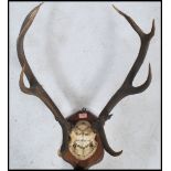 A good set of early 20th century mounted deer antlers bearing notation for 1921 to the skull and