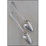 A pair / set of 2 19th century Georgian silver table spoons bearing London hallmarks date letter