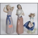 A collection of Lladro figurines ( 5 total )to inc