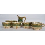 An early 20th century decorative Art Nouveau French tea service in green white and gilt finish