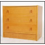 A retro 20th century oak chest of drawers, the drawers with pull handles and raised on shaped