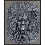 A silver plated vesta case being cast in relief in the form of a native Indian having hinged top