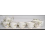 A vintage 20th century Staffordshire 6 person bone china tea service having a catkins flower