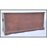 A Victorian 19th century elm wood blanket box chest raised on plinth base with hinged top having