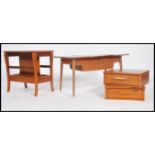 A collection of retro furniture to include a teak wood magazine rack table, a pair of teak single