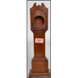 A Victorian mahogany pocket watch stand in the form of a long-case / grandfather clock. The mahogany