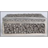 An early 20th century Oriental Chinese silver table top cigarette box of rectangular form having a