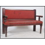 A mid century solid wood municipal railway / train station waiting room interior bench seat with