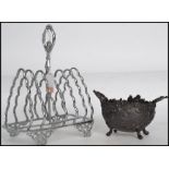 A stunning late 19th century silver plated six slice toast rack together with a 19th century spelter