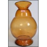 A large 20th century retro studio art glass orange baluster vase of tapering form having a bulbous